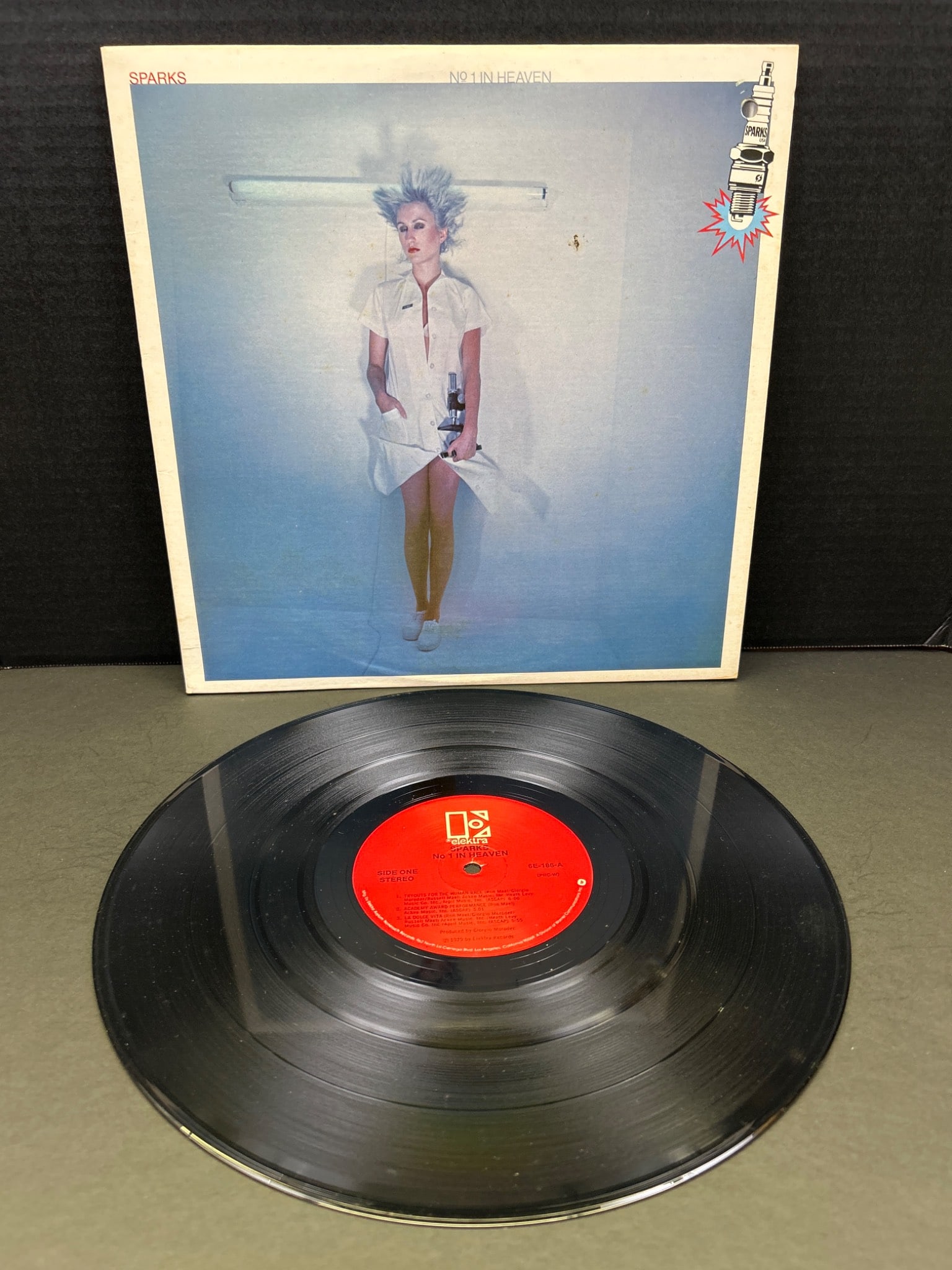 Sparks 'No. 1 In Heaven' Vinyl Record Album with Original Sleeve: Sparks 'No. 1 In Heaven' vinyl record album features the original LP pressing. Includes the original cover and sleeve artwork as shown. Manufactured under the Virgin label. Condition of both vinyl and