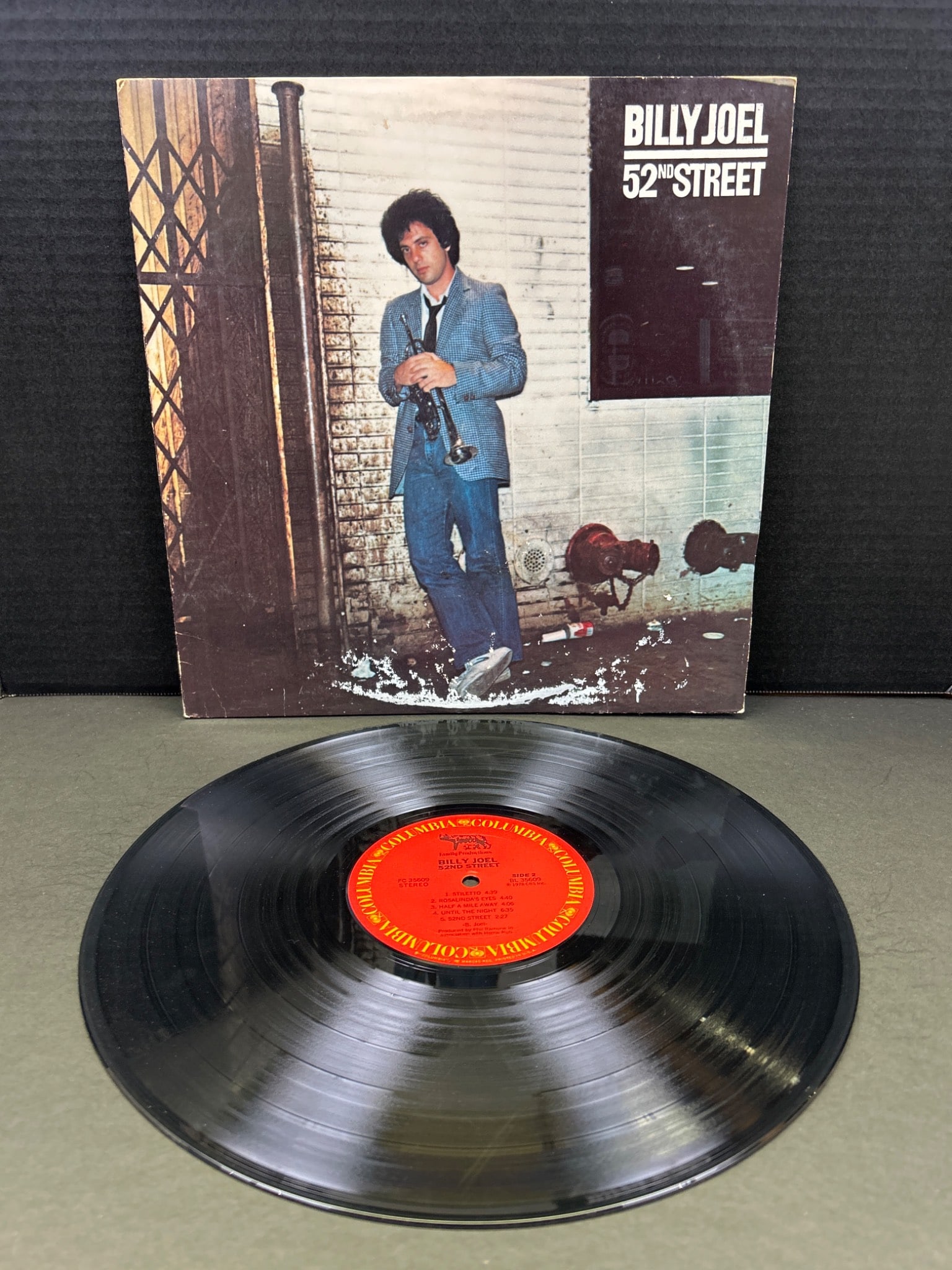 Billy Joel 52nd Street Vinyl LP Album, Columbia Records, 1978: This is a Billy Joel "52nd Street" vinyl LP from Columbia Records, released in 1978. The record features catalog number JC 35609. The vinyl and cover condition varies; refer to detailed visual