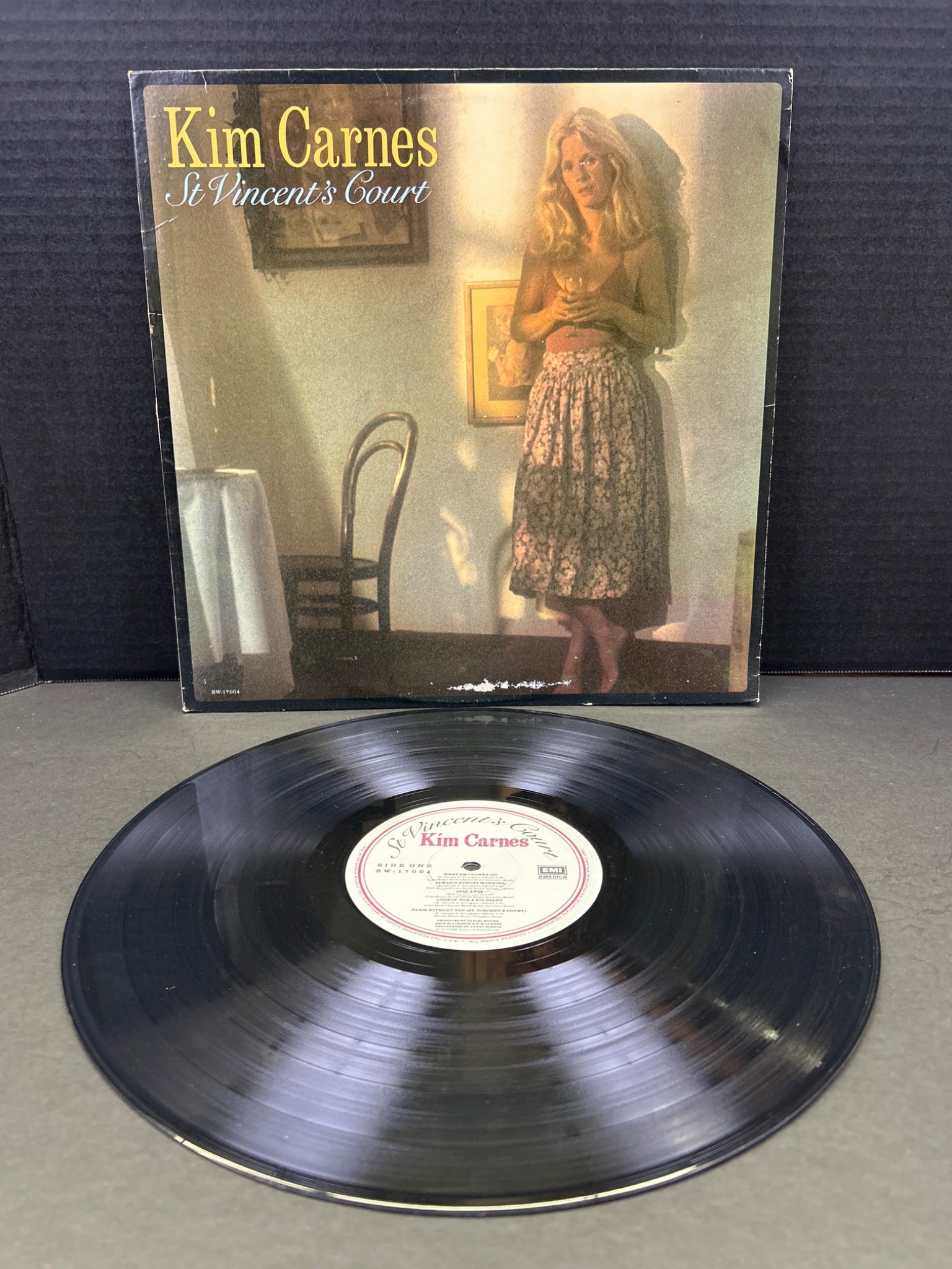 Kim Carnes 'St. Vincent's Court' Vinyl LP Record Album: Kim Carnes 'St. Vincent's Court' vinyl LP album by EMI America Records. Catalog number SW-17008. Includes original inner sleeve with artist imagery and lyrics. Condition appears to be good with some s