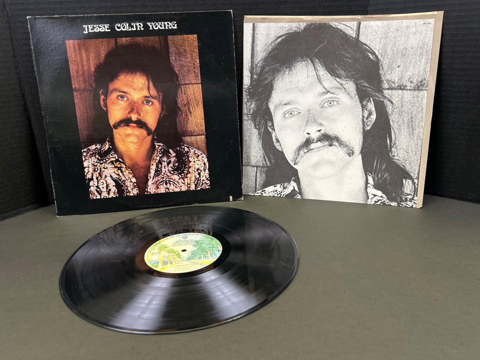 Jesse Colin Young Vinyl Records Including 'Jesse Colin Young' and 'Song for Juli': This lot includes two vinyl records by Jesse Colin Young. The items are: 'Jesse Colin Young' (featuring front and back album artwork) and 'Song for Juli' (featuring front artwork). Both records have v
