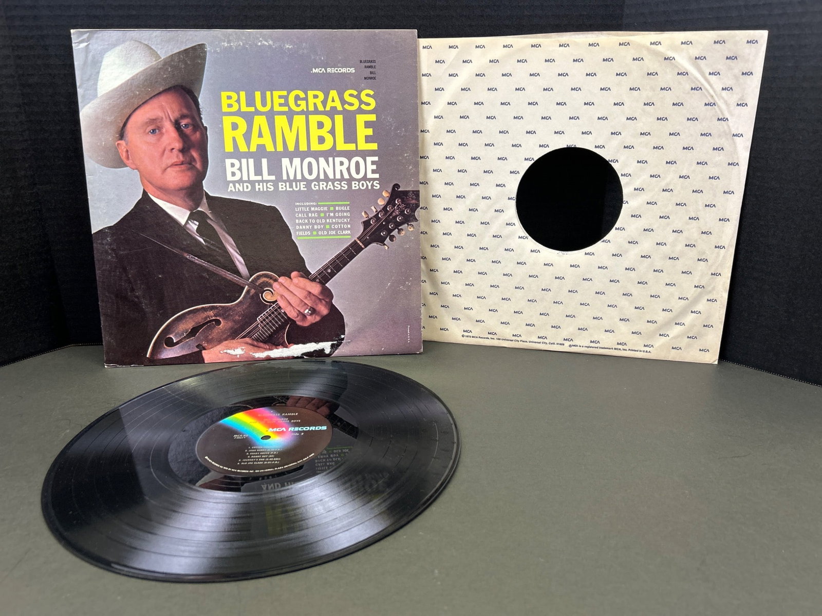 Bluegrass Ramble by Bill Monroe and His Blue Grass Boys Vinyl Record: Bluegrass Ramble vinyl record by Bill Monroe and His Blue Grass Boys. Released under the label Decca Records, catalog number DL 74602. Includes original sleeve and cover. Condition appears to show