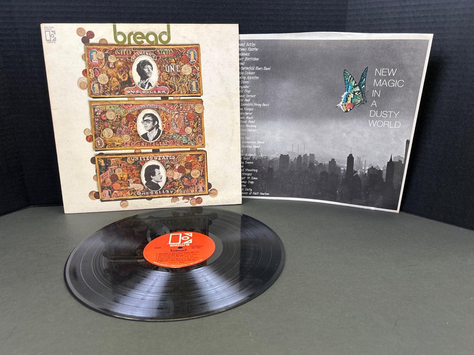 Bread On The Waters Vinyl LP Record with Original Sleeve: Vinyl LP record of 'On The Waters' by Bread, released under Elektra Records (EKS-74076). Includes the original album cover and inner sleeve with lyrics and imagery. Condition of the vinyl and sleeve