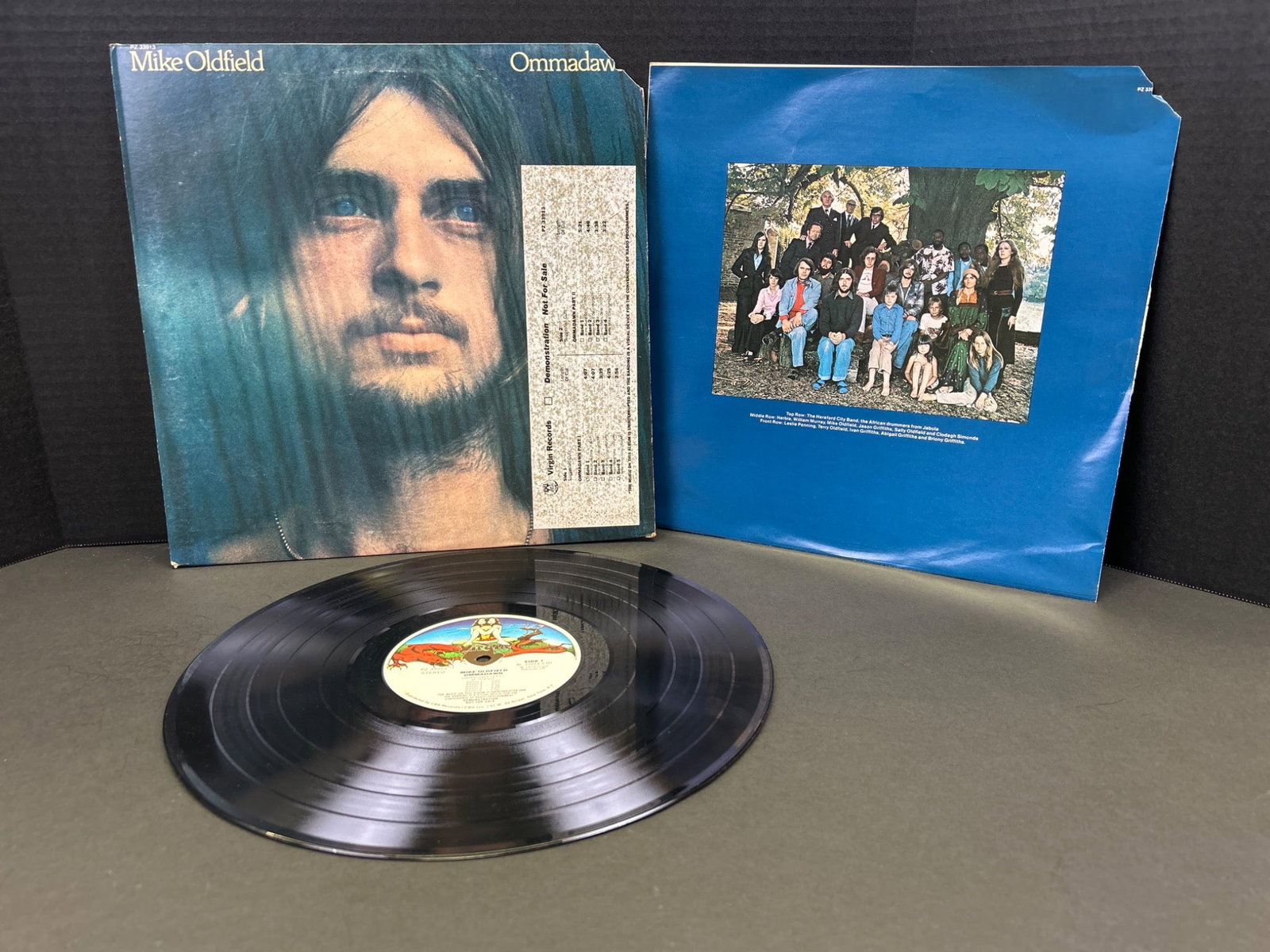 Mike Oldfield â€˜Ommadawnâ€™ Vinyl LP Record, Original Pressing: This lot includes a vinyl LP of Mike Oldfieldâ€™s album â€˜Ommadawn.â€™ The record is accompanied by its original sleeve, showing artwork and track