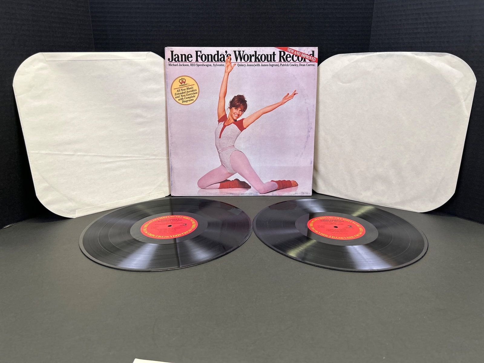 Jane Fondaâ€™s Workout Record Vinyl LP Set With Instruction Booklet: This two-record set includes Jane Fondaâ€™s â€œWorkout Recordâ€ with both vinyl LPs and the original instruction booklet. The LPs feature exercise