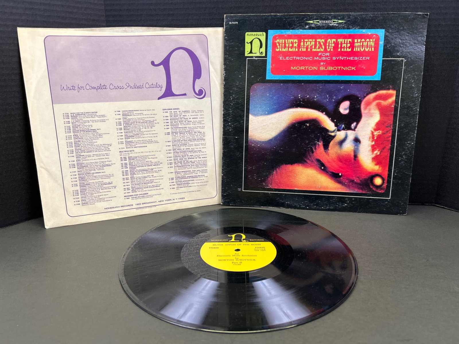 Silver Apples of the Moon Vinyl Record by Morton Subotnick, 1967 First Pressing: This is a 1967 first pressing of 'Silver Apples of the Moon' by Morton Subotnick. Released by Nonesuch Records, serial number H-71174. The vinyl record shows minimal wear, and the original sleeve and