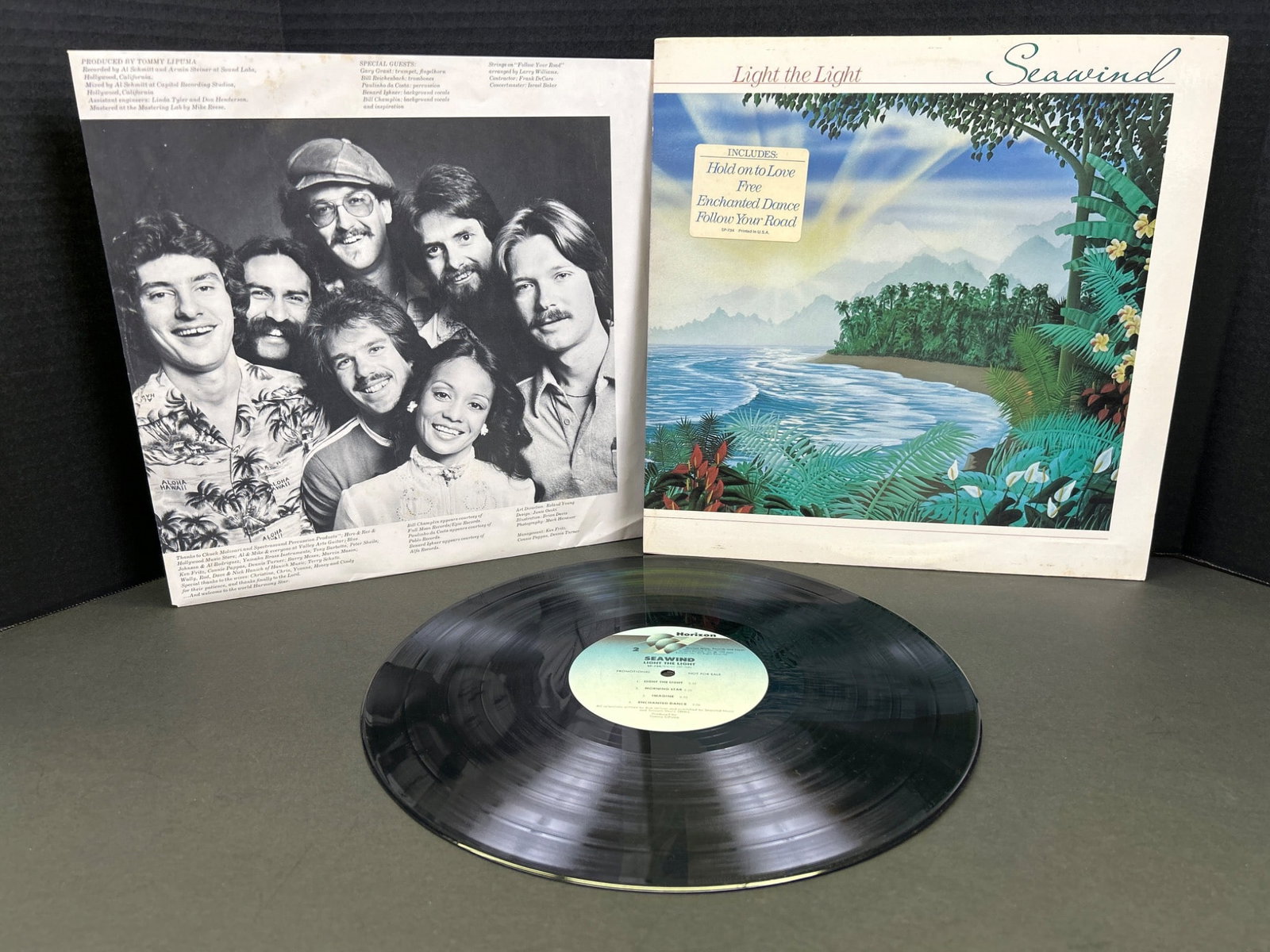 Seawind Vinyl Record Album with Original Sleeve - 1976, CTI Records: Original 1976 Seawind vinyl record album produced by CTI Records. Includes the record, original sleeve with lyrics and band information, and cover. Condition ungraded but shows visible wear