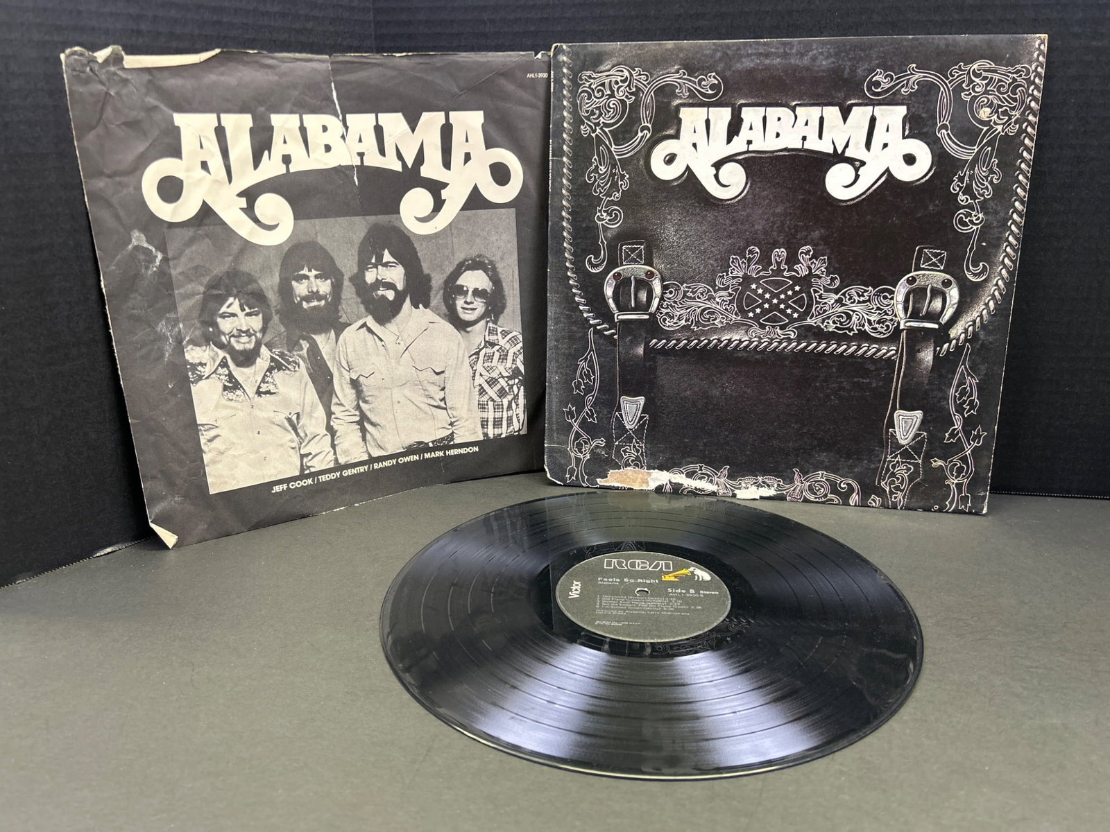Alabama Vinyl Record with Original Cover and Inserts: This lot includes an original vinyl record by the band Alabama. The record is accompanied by the original cover and inserts featuring the band's imagery and lyrics. Condition of the cover and inserts 