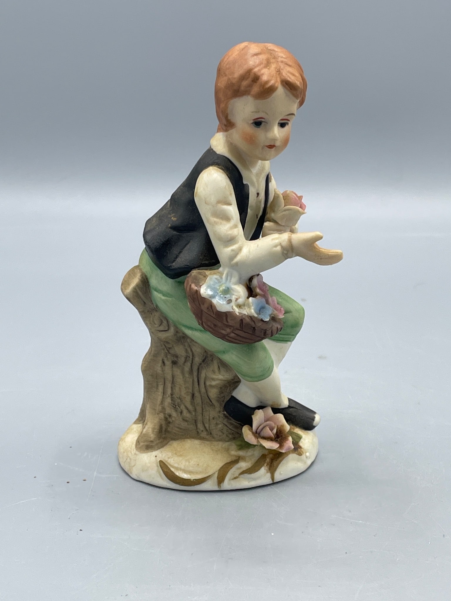 Hand-Painted Porcelain Figurine of a Boy With Basket of Flowers - 2