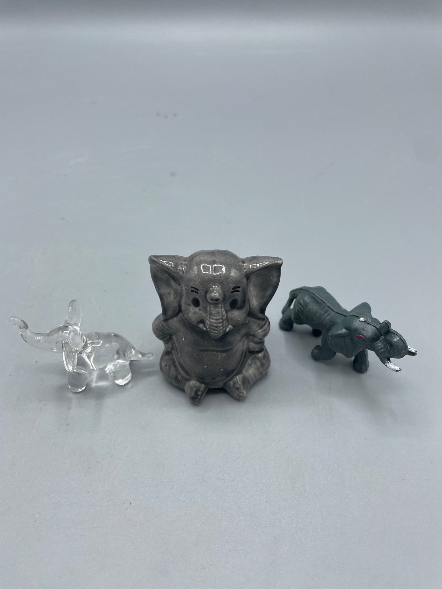 Three Figurines: Clear Glass, Ceramic, and Painted Resin Elephants - 2