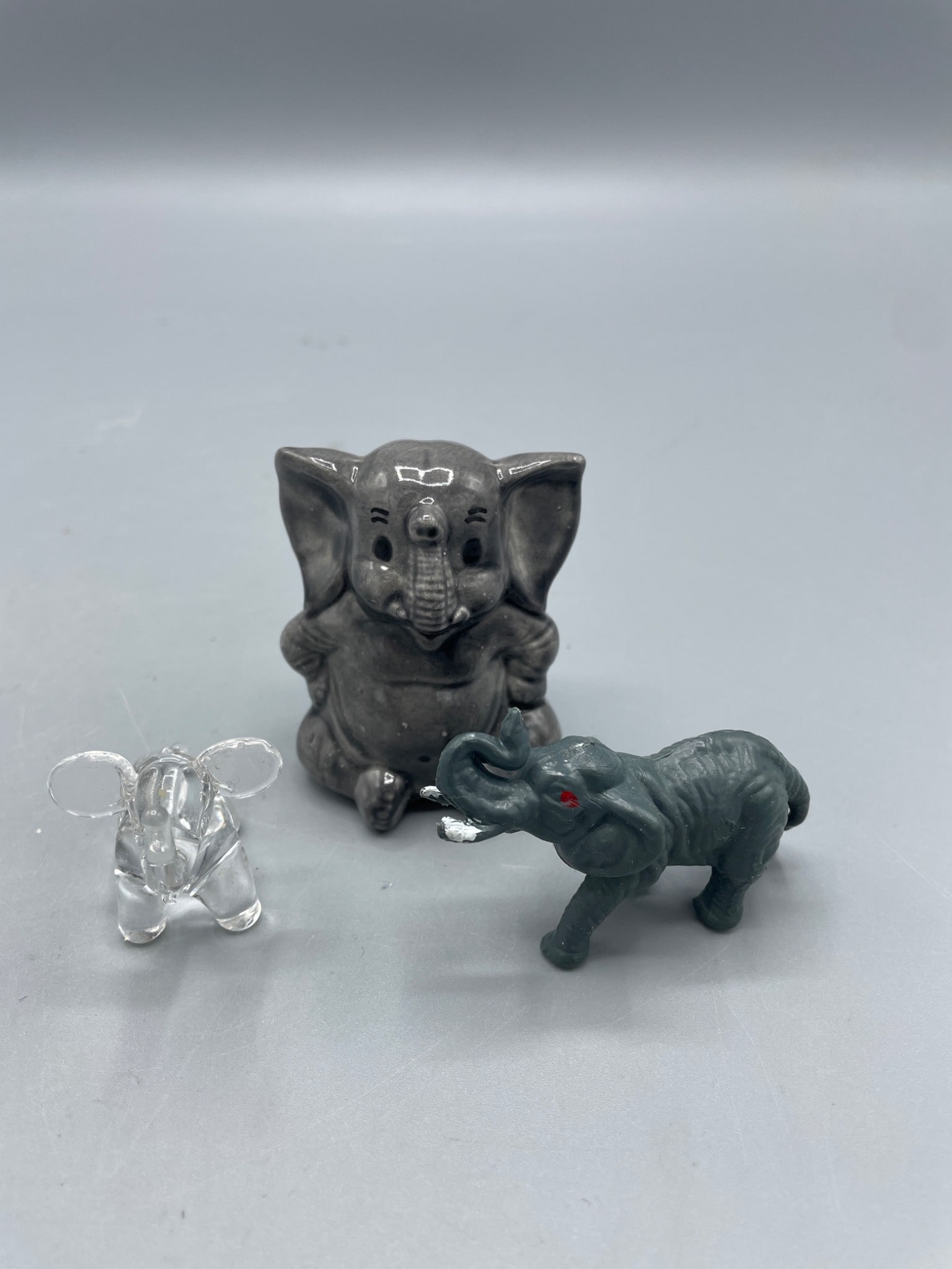 Three Figurines: Clear Glass, Ceramic, and Painted Resin Elephants - 4