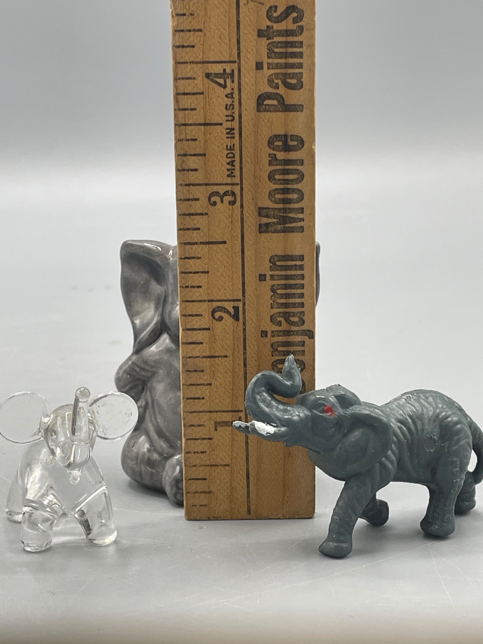 Three Figurines: Clear Glass, Ceramic, and Painted Resin Elephants - 5