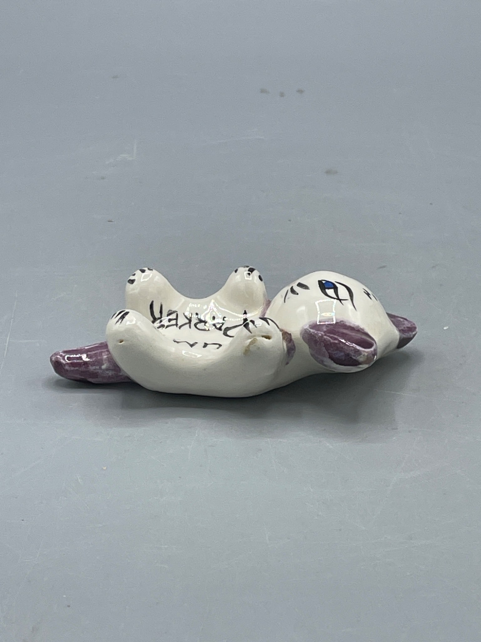 Ceramic Cat Figurine Labeled 'Gum Parker,' Marked 'Florida,' Approximately 3 Inches - 4