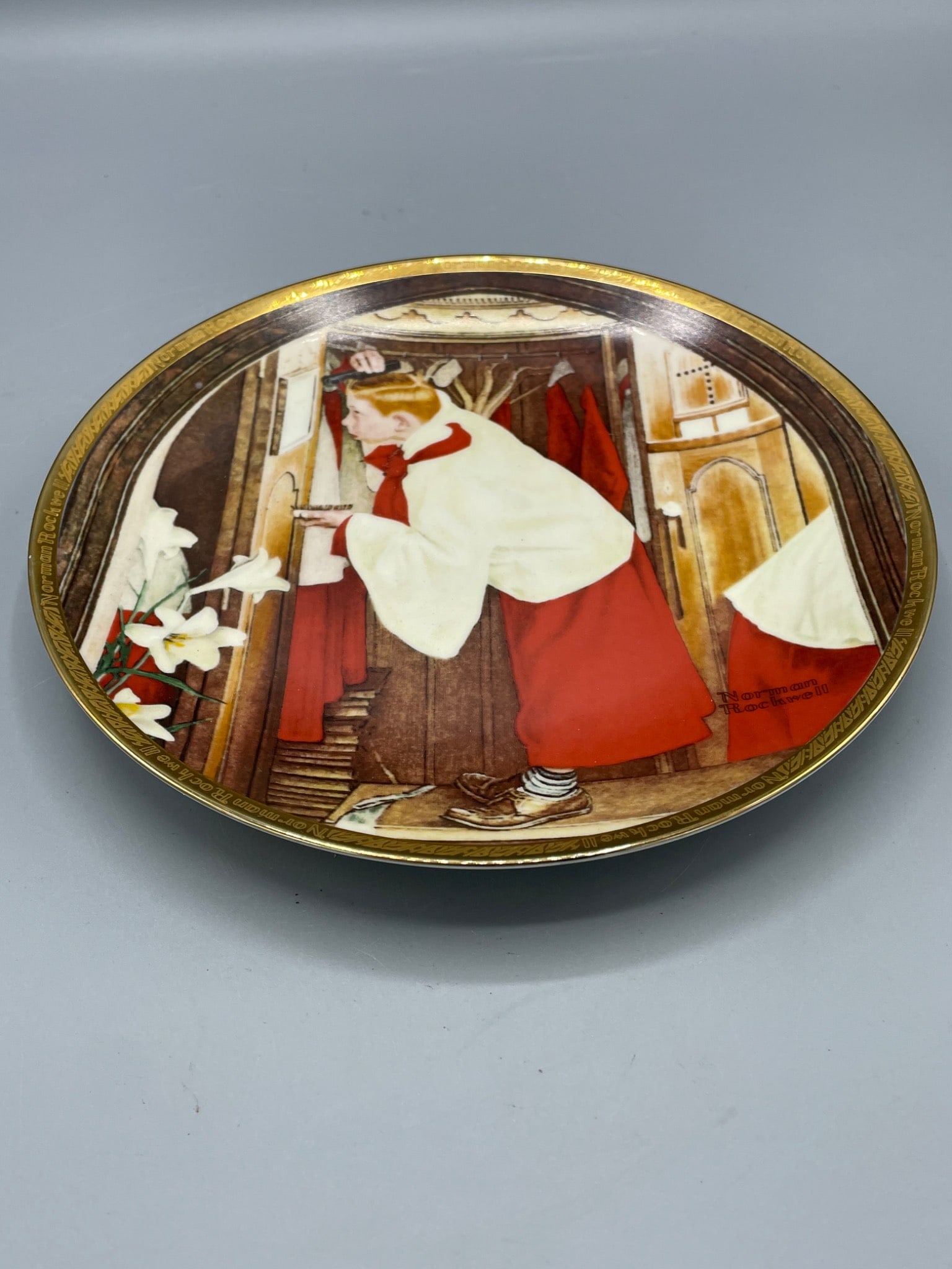Norman Rockwell 'The Choir Boy' Collector Plate by Rose Valley China: This is a decorative collector plate titled 'The Choir Boy' by Norman Rockwell. Created as an exclusive presentation for Rose Valley China, it features artwork originally published in The Saturday Eve