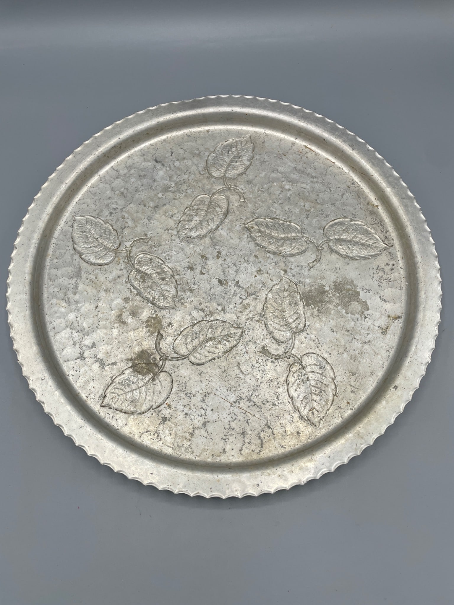 Farberware Wrought Aluminum Serving Tray with Leaf Design, Brooklyn, NY: A Farberware wrought aluminum serving tray, featuring an embossed leaf design on the surface. Manufactured in Brooklyn, NY, as indicated by the hallmark. The tray measures approximately 15 inches in