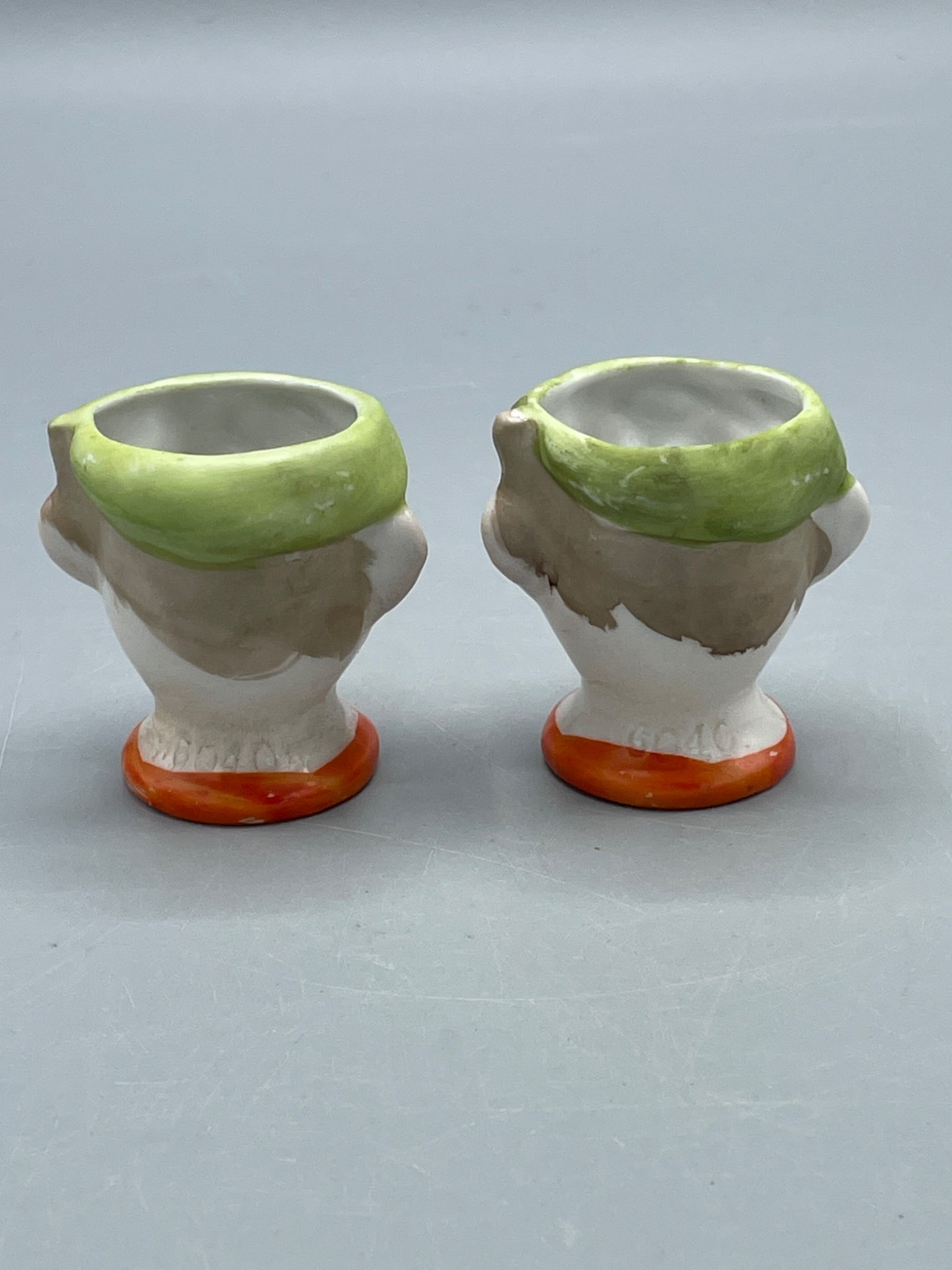 German Ceramic Figural Egg Cups with Green Accents - 2