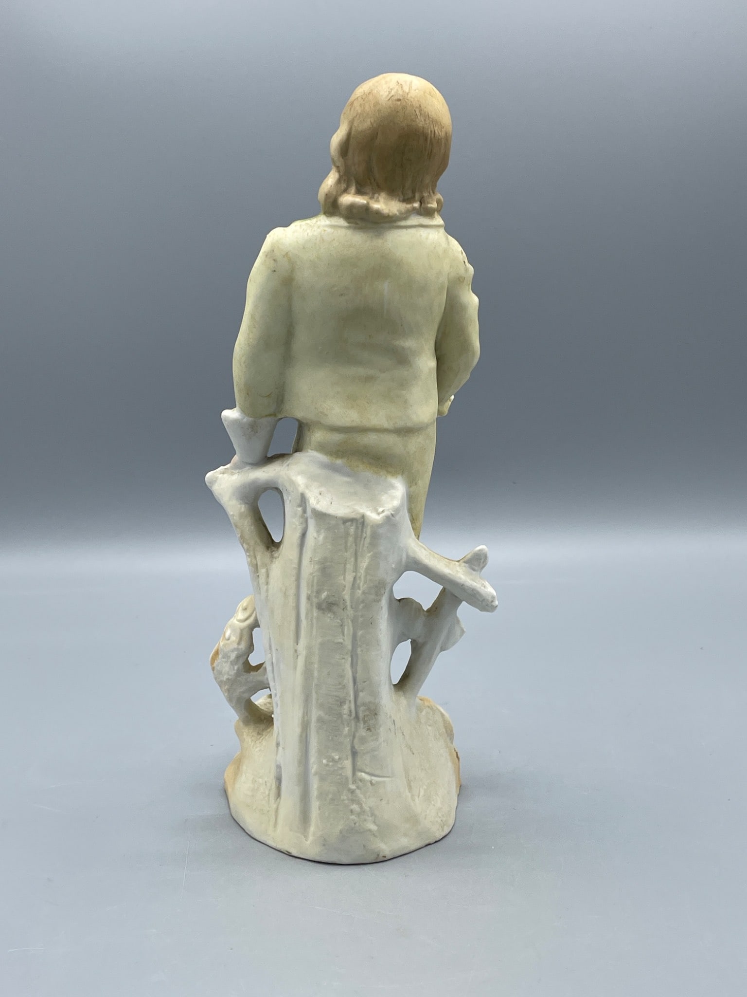 Porcelain Figurine of Boy Holding Horseshoe with Green and Yellow Outfit - 3