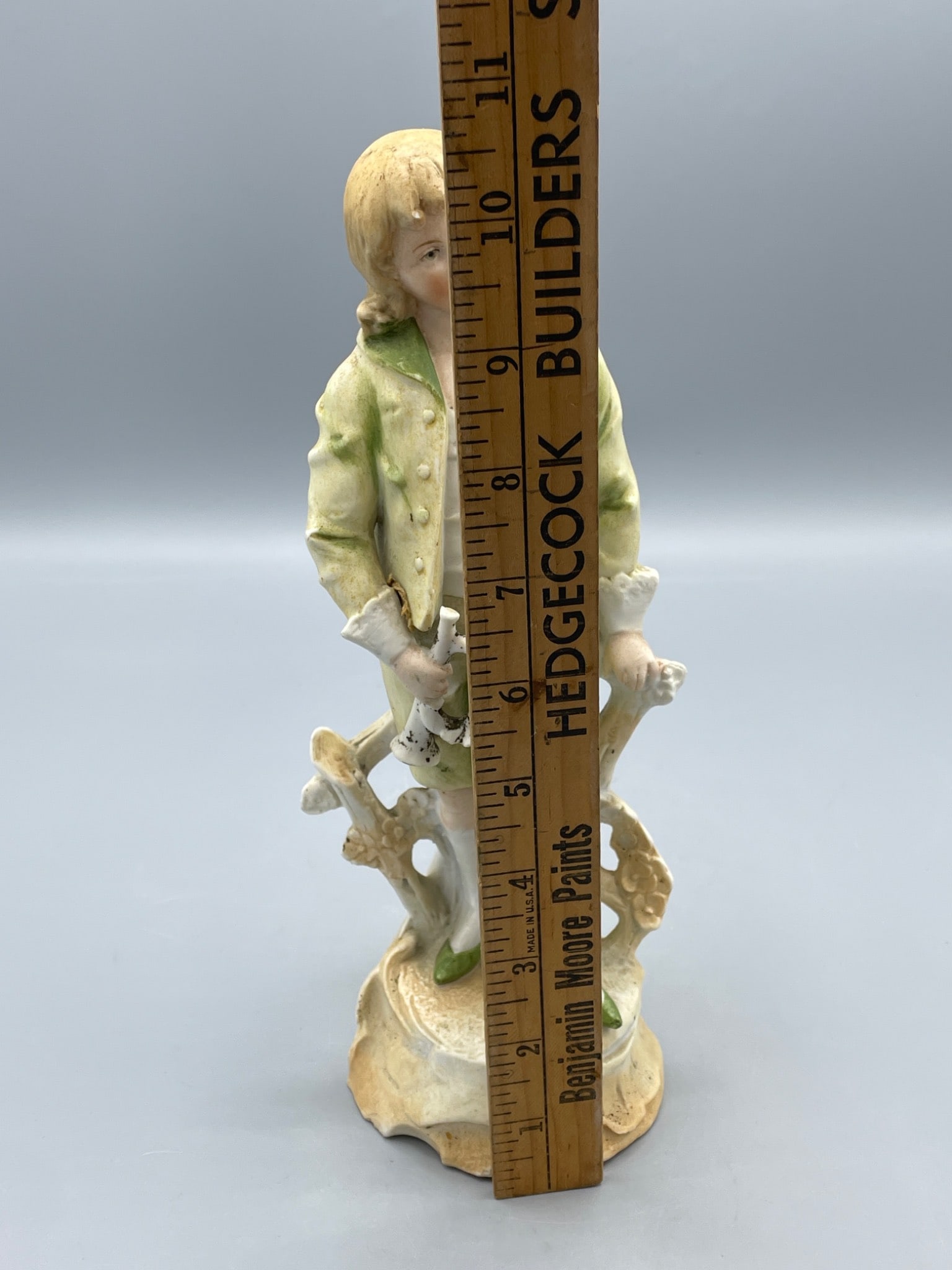 Porcelain Figurine of Boy Holding Horseshoe with Green and Yellow Outfit - 6