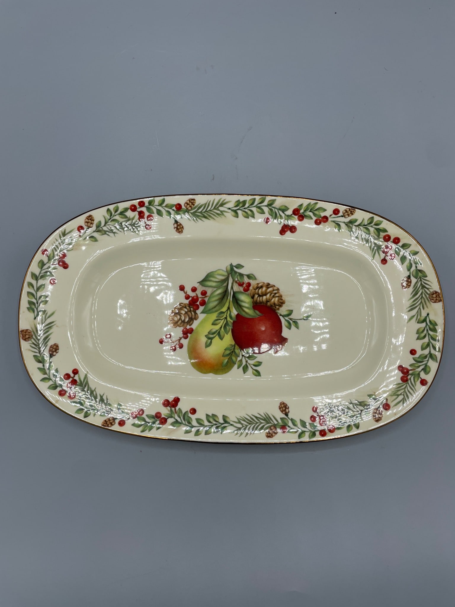 Lenox Williamsburg Boxwood and Pine Oblong Sandwich Tray: Lenox Williamsburg Boxwood and Pine sandwich tray, oblong in shape. Features fruit and pinecone motif with a decorative border. Marked as dishwasher and microwave safe. Measures approximately 12 inche