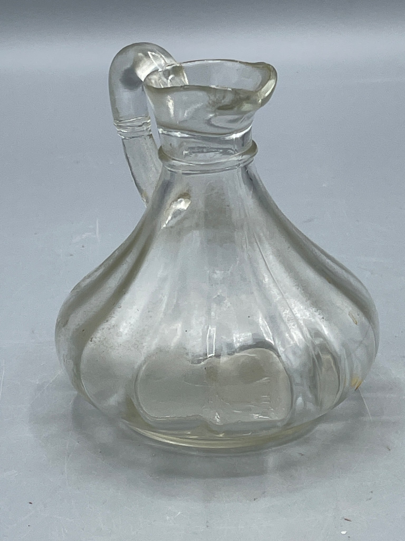 Clear Glass Pitcher with Handle and Curved Design - 2