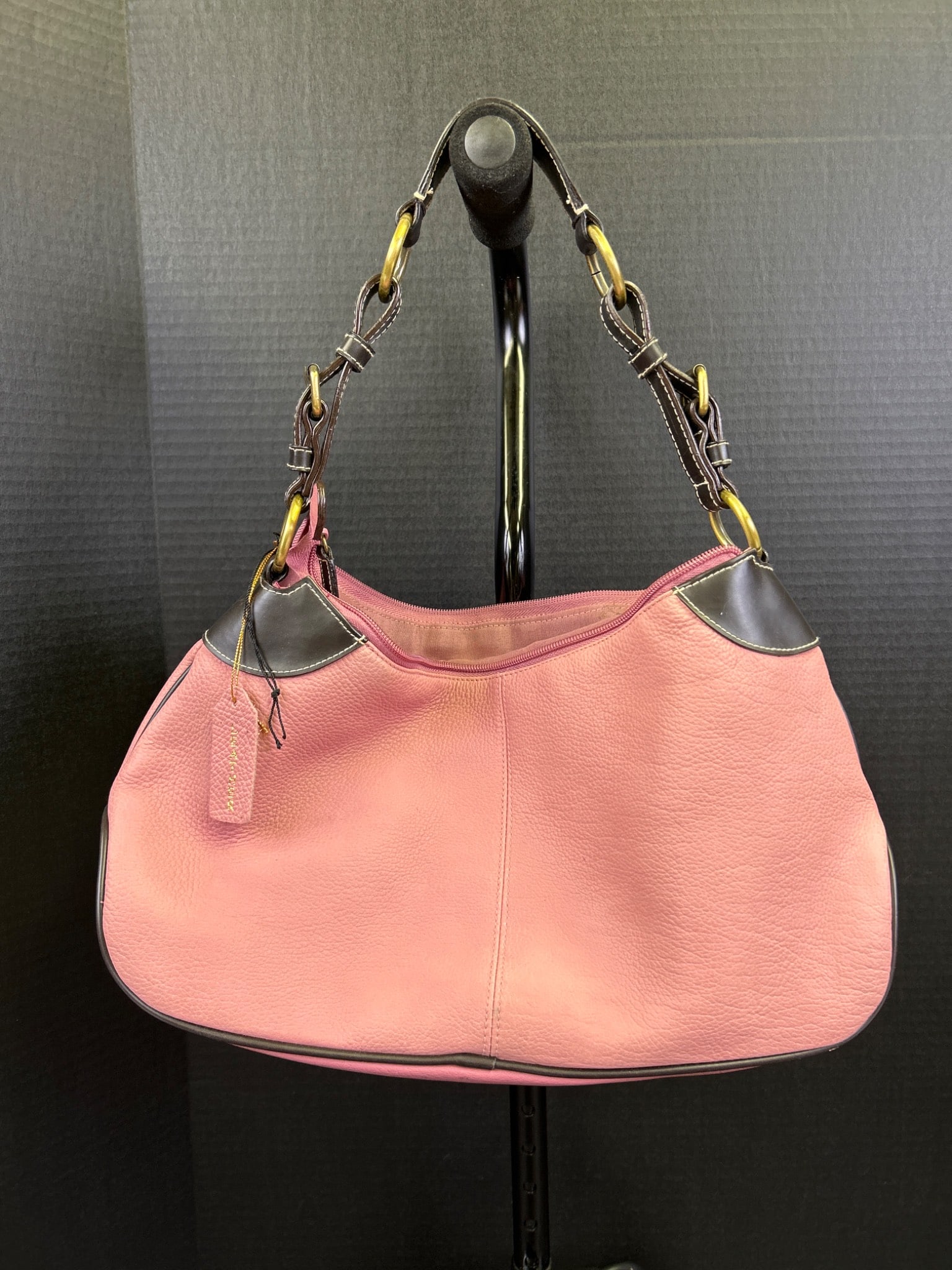 Great American Leatherworks Pink Shoulder Bag with Brown Accents: This shoulder bag is from Great American Leatherworks, featuring a pink body with brown accents at the corners and strap. The bag includes an adjustable strap with metal hardware, zippered closure,