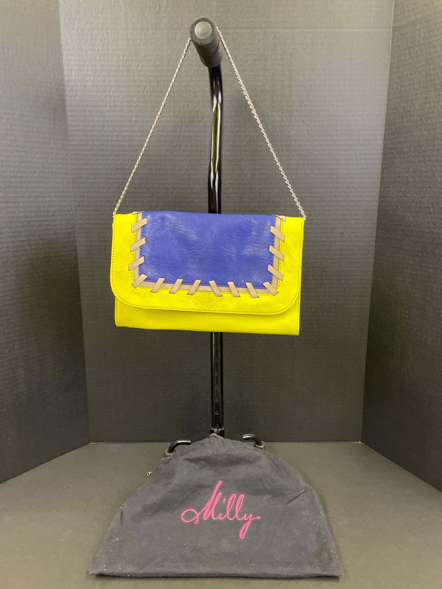 Milly Yellow and Blue Leather Chain Strap Clutch Bag: Milly clutch bag featuring contrasting yellow and blue leather with a chain strap and magnetic closure. Includes interior zip and slip pockets. Comes with original Milly dust bag and tags showing