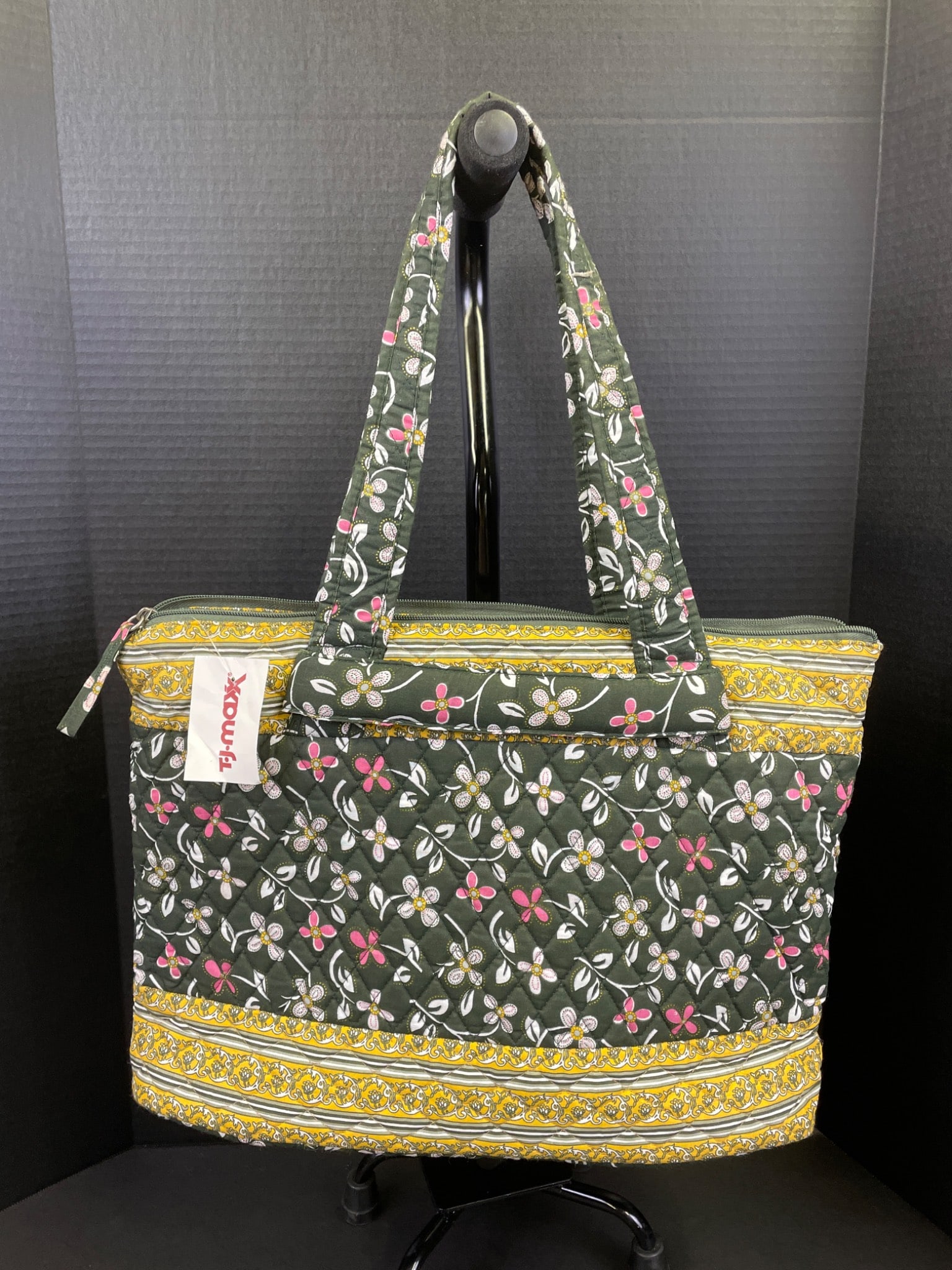 Provion Travel Stars Collection Tote Bag with Floral Pattern and Zip Closure: Provion Travel Stars Collection tote bag featuring a floral pattern in green, yellow, and pink tones. Includes a zippered main compartment, multiple organizational pockets inside, and dual straps.
