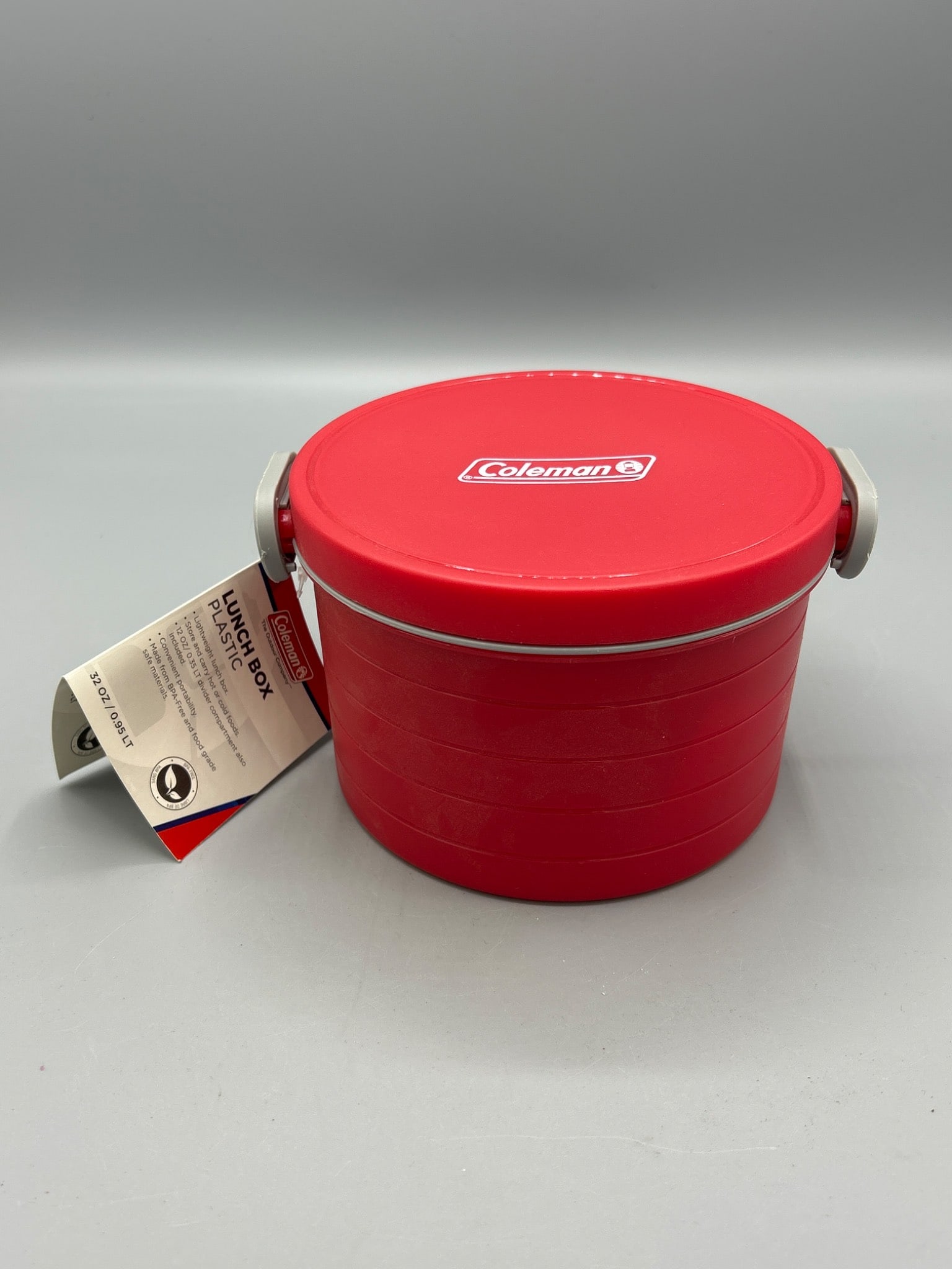 Coleman Lunch Box, Plastic, 32 Oz/0.95 L, Brand New: This is a brand new, unused Coleman Lunch Box made of BPA-free, food-grade plastic materials. It has a total capacity of 32 oz (0.95 L) and comes with a 12 oz (0.35 L) divider compartment for added