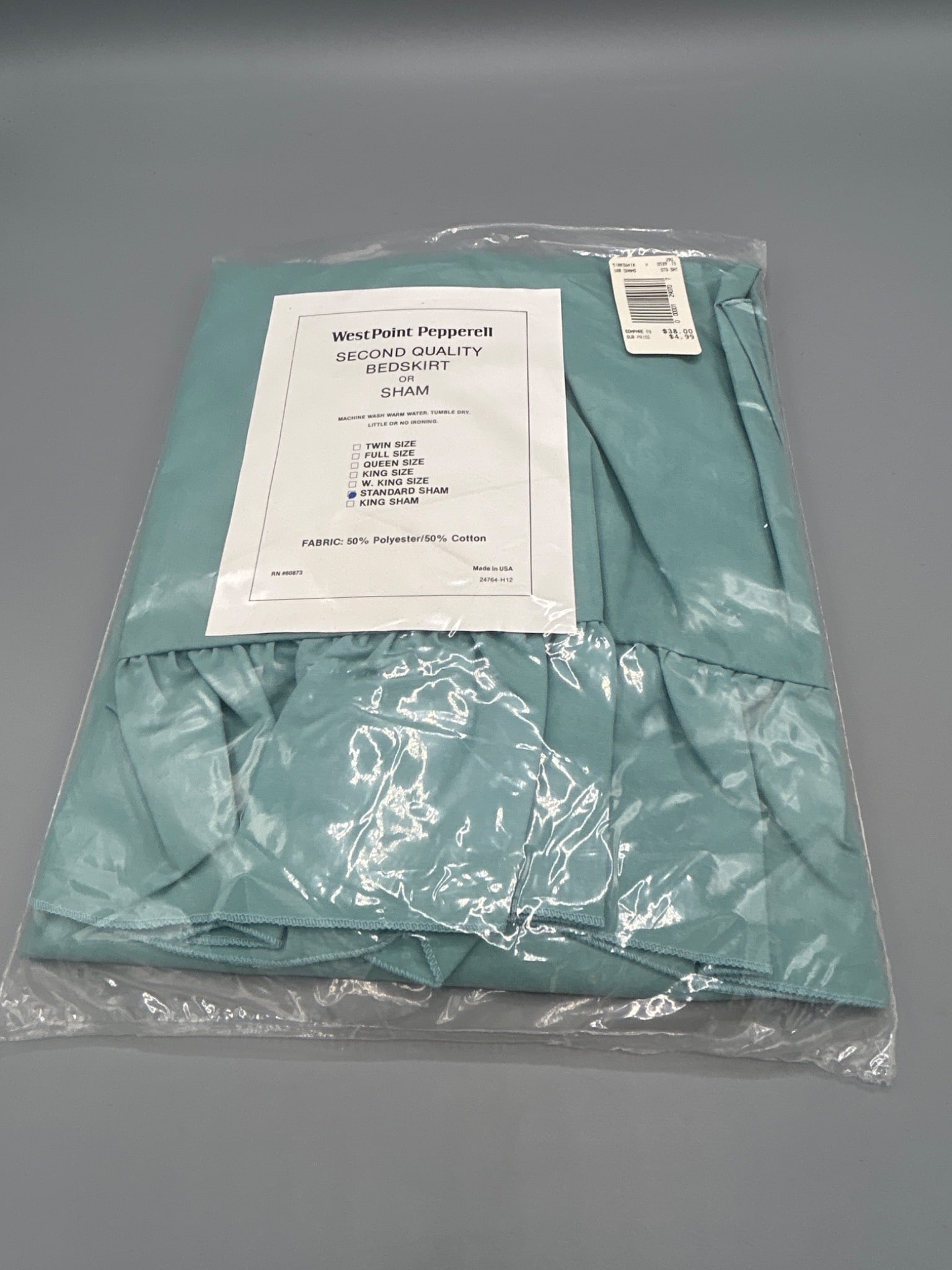WestPoint Pepperell Second Quality Standard Sham, 50% Polyester/50% Cotton: This is a WestPoint Pepperell second quality standard sham. The fabric composition is 50% polyester and 50% cotton. Dimensions correspond to standard sham size. The item is in original packaging with