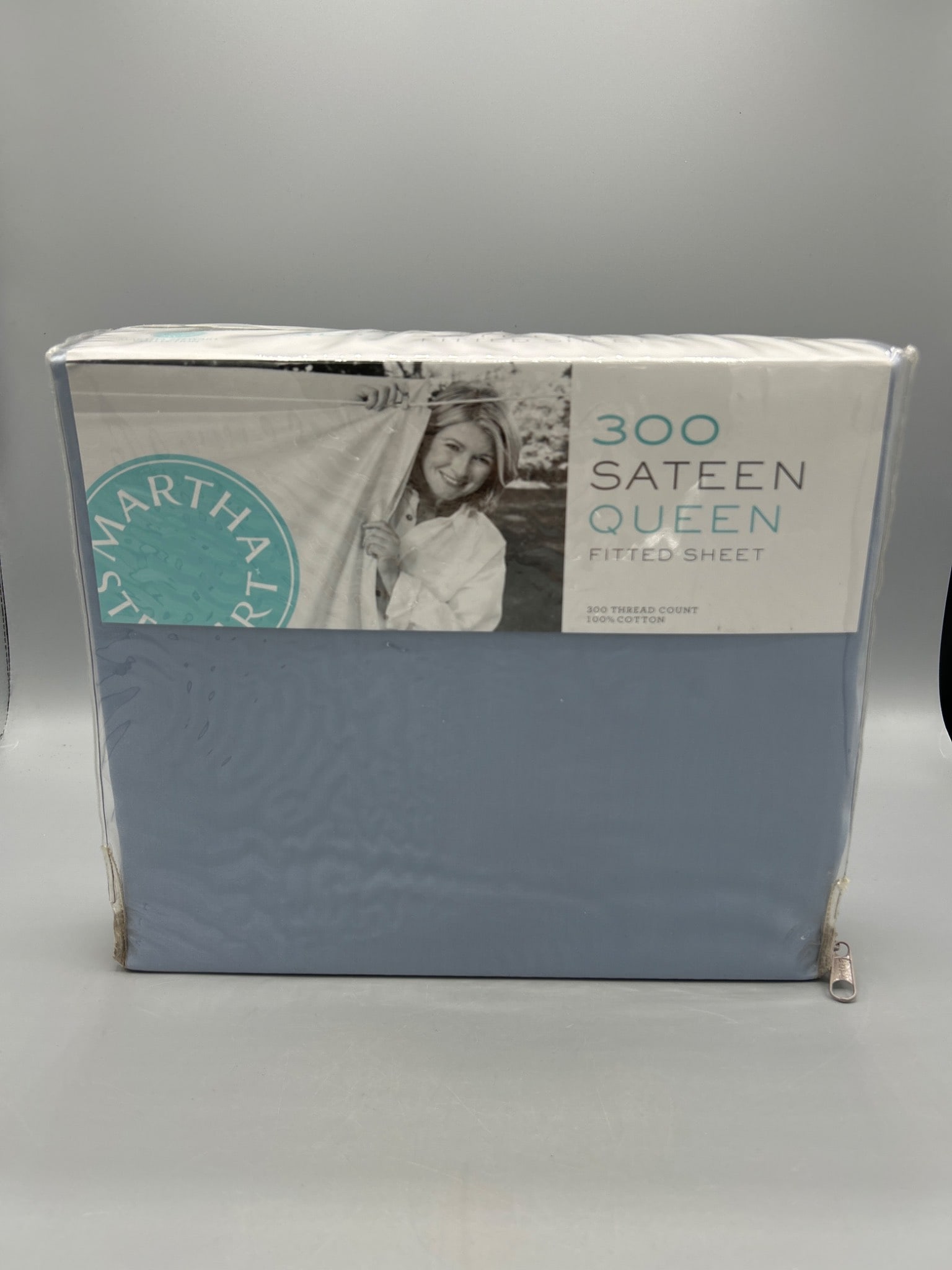 Martha Stewart Collection Sateen 300 Thread Count Queen Fitted Sheet: Brand new, never used fitted sheet from the Martha Stewart Collection. Features a 300-thread count sateen weave and is made of 100 percent cotton. The color is a light blue, and it fits a queen-sized 