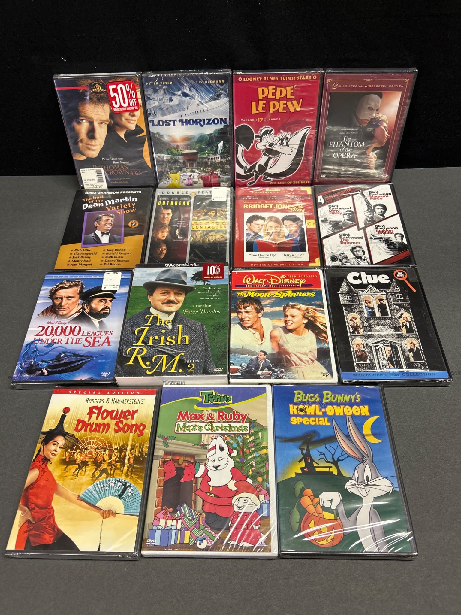 Sealed DVDs Featuring Films and Cartoons from Various Genres: Sealed DVDs including 20 movies and cartoon titles such as 'The Phantom of the Opera (2-Disc Special Widescreen Edition)', 'Clint Eastwood double feature (Dirty Harry/Sudden Impact)', 'The Irish R.M. 