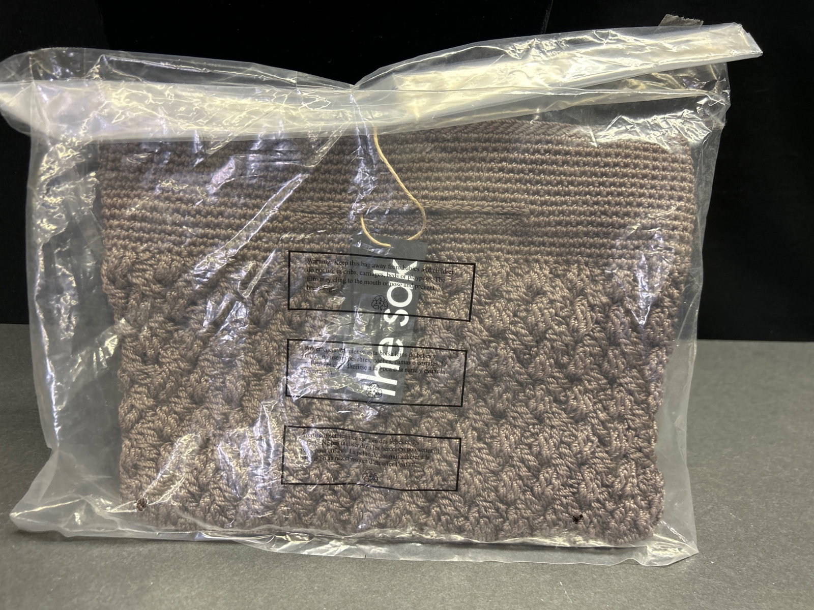Linden Gen Crossbody PP Handbag, Style 109467, Mushroom Color: Linden Gen Crossbody handbag in mushroom color with a quilted design. Model style 109467 with barcode 1000081335, crafted from recycled materials as noted on the tag. The item remains sealed in its