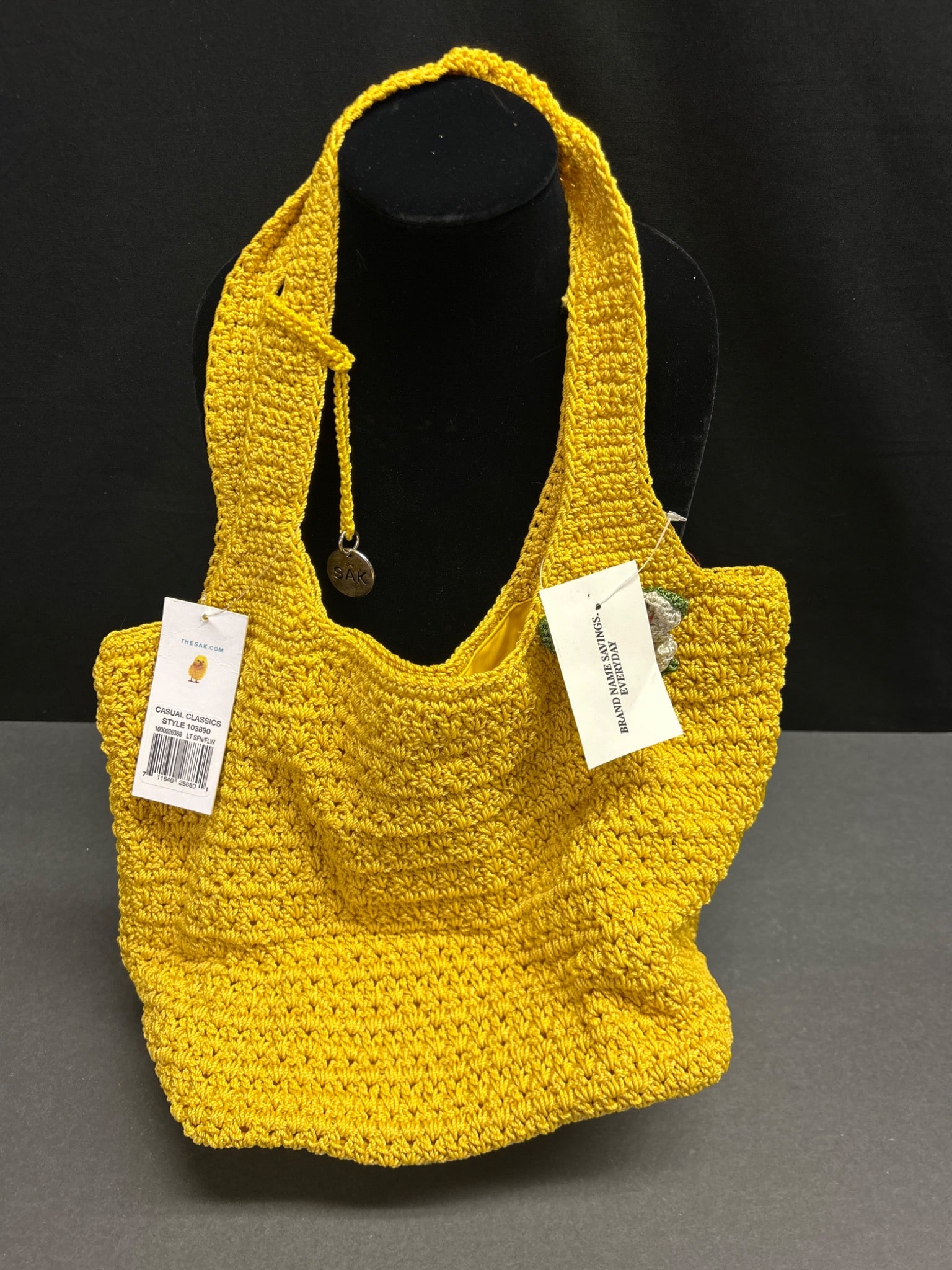 The Sak Casual Classics Style 103890 Crochet Shoulder Bag in Yellow: This is a crochet shoulder bag by The Sak, model number 103890 ('Casual Classics'). It features a yellow woven exterior with a matching yellow fabric-lined interior. The interior includes a zippered