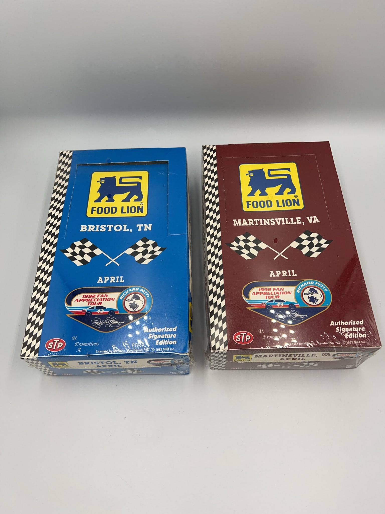 1992 Food Lion Bristol TN Martinsville VA Sets: Two sealed 1992 Food Lion Fan Appreciation Tour sets featuring Bristol, TN and Martinsville, VA races. Authorized Signature Editions, licensed by MPCA Inc., and officially licensed STP products.