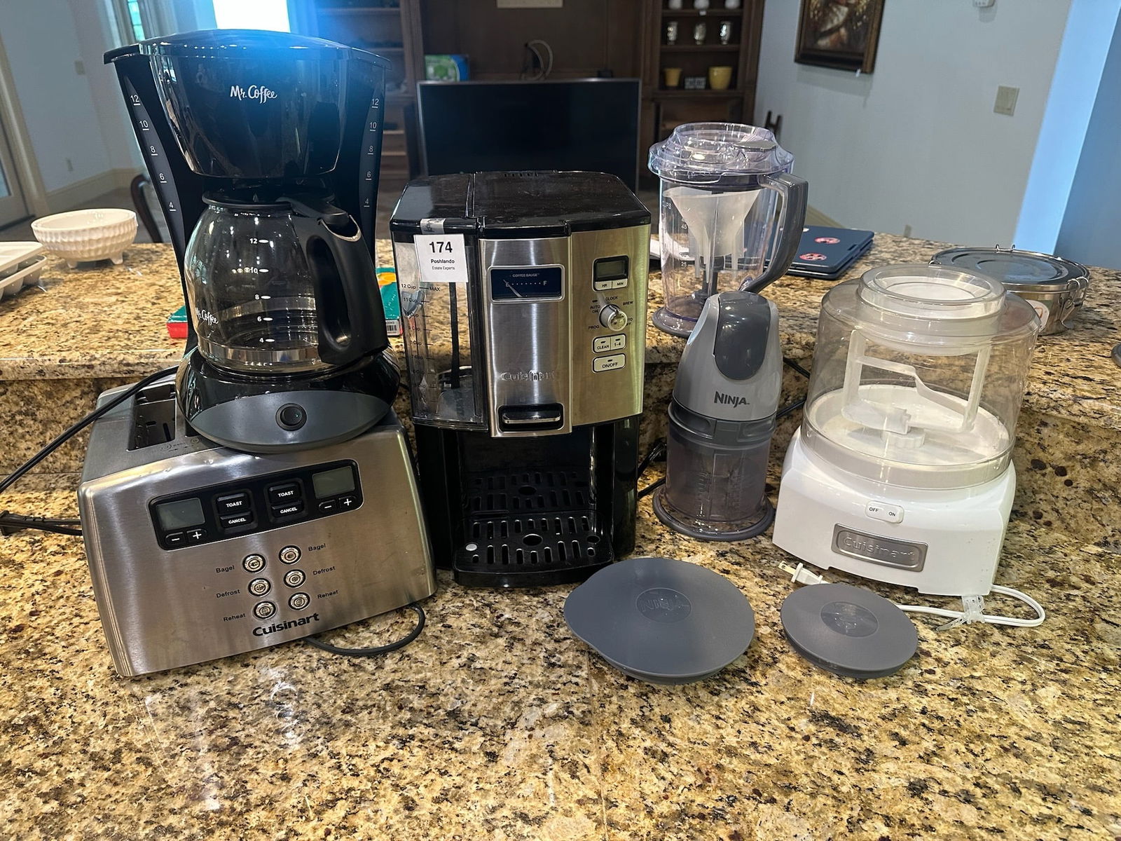 Small Kitchen Appliance Group Cuisinart, Mr. Coffee, Ninja: Lot of countertop kitchen appliances including a Cuisinart stainless toaster, Mr. Coffee drip coffee maker, Cuisinart espresso/cappuccino machine, Ninja chopper/blender, and Cuisinart ice cream maker.