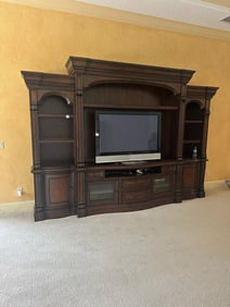 Large Wooden Entertainment Center with Shelving and TV