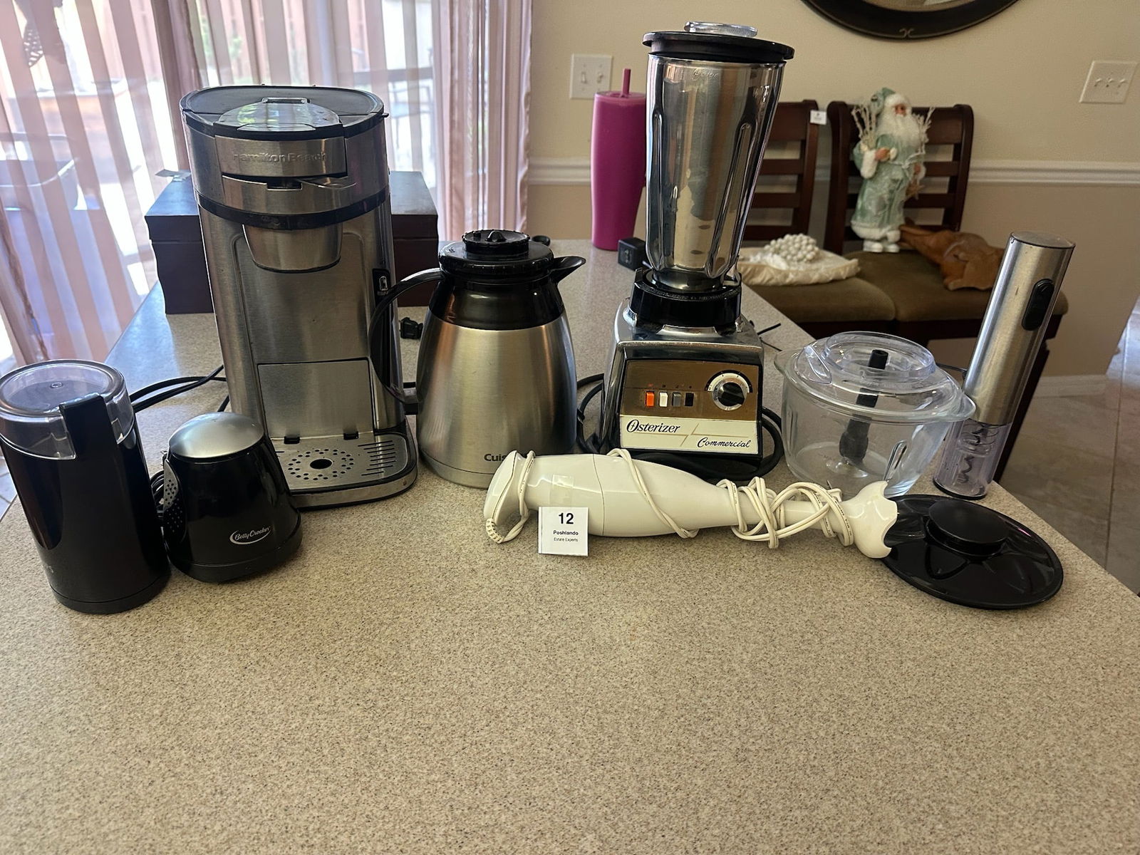 Small Kitchen Appliance Lot: Group of assorted small kitchen appliances including Hamilton Beach coffee maker, Cuisinart thermal carafe, Osterizer commercial blender, hand blender, coffee grinders, and accessories. Untested, show