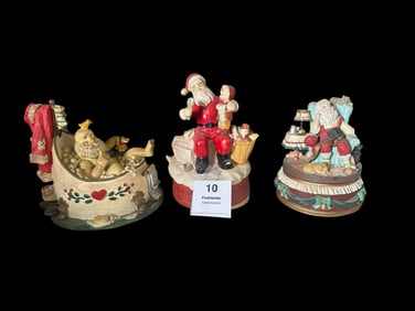Trio of Santa Claus Figurines