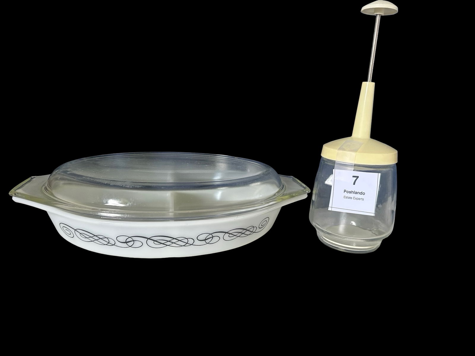 Pyrex Scroll Casserole & Vintage Glass Butter Churn: (1) Pyrex oval casserole dish with lid in the "Scroll" pattern, white with black filigree swirl design, mid-century modern style.(1) Vintage clear glass jar butter churn with yellow plastic top and pl