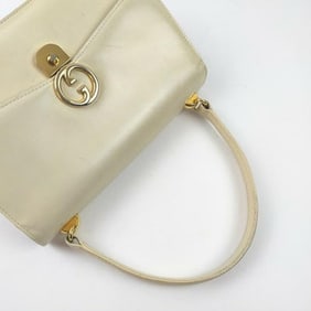 Vintage, Gucci, cream leather, 1973 top handle style purse with gold tone accents!