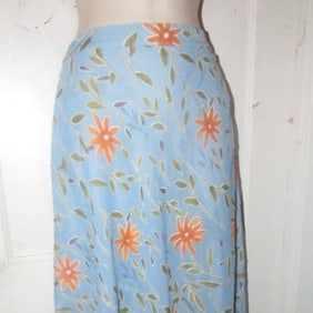 NWT, Moschino, size 46 IT/12 US, periwinkle, midi A-line skirt with stylized orange & green floral