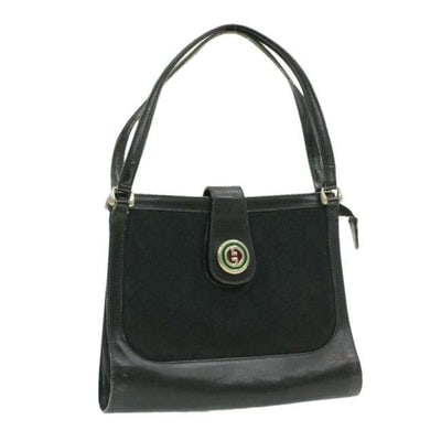 Rare, GUCCI, black Guccissima print satchel/tote bag w/ a 1973 style, round, red and green enamel GG: * ONE OF A KIND GUCCI STYLE! * For sale is an early, rare, GUCCI, black Guccissima print canvas and black leather, satchel/ tote bag with two handles, a structured body, and a round, red and green ena