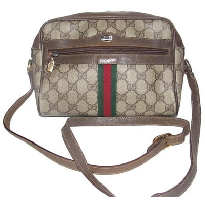 Gucci Vintage shoulder bag Shades Of Brown Large G Logo Print Coated Canvas Leather: For sale is a Gucci, brown Guccissima print coated canvas and brown leather, roomy, shoulder bag with front zip pocket and red and green striped accent! It is a vintage style that Gucci has re-release
