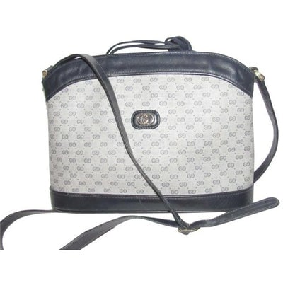 Gucci Vintage Navy Blue Leather And Blue Small G Print Coated Canvas Satchel: For sale is an unusual, vintage, Gucci, navy blue leather and blue small G print coated canvas, drawstring top bag with a structured base that is attached to a looser tapered leather drawstring top, a