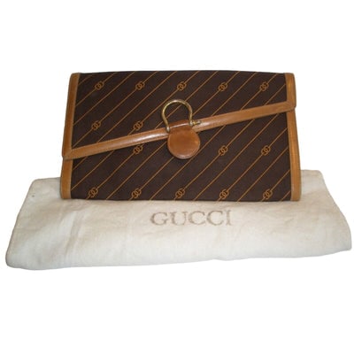 GUCCI early brown logo print XL asymmetrical envelope top clutch: ONE OF A KIND VINTAGE GUCCI! For sale is a vintage, GUCCI, early brown logo print canvas and camel leather, extra large, asymmetrical envelope top clutch with a gold equestrian accent! This is a fabul