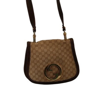 Gucci brown Guccissima print Blondie saddle bag: RECENTLY RE-RELEASED ONE OF A KIND, VINTAGE, ICONIC GUCCI! For sale is a Gucci brown Guccissima print canvas and leather, Blondie style, saddle bag shoulder purse with a large, gold 'GG' cut-out emble