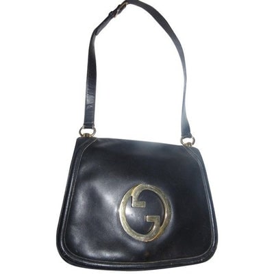 Vintage Gucci midnight blue leather 'Blondie' saddle style, shoulder bag with large, gold 'GG': RECENTLY RE-RELEASED BY GUCCI! For sale is a vintage, rare, delicious navy blue leather, Gucci 'Blondie', shoulder bag with large, gold 'GG' emblem and multiple compartments! It is a rare style and th