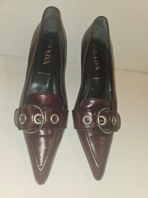For sale is a stunning pair of Prada kitten heels in size 36.5 (US 6.5), crafted from buttery soft: For sale is a stunning pair of Prada kitten heels in size 36.5 (US 6.5), crafted from buttery soft leather in a rich burgundy-brown shade. These elegant pumps feature a sleek pointy toe and a comforta