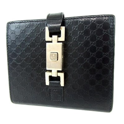 In April, save 15% with the code SPRLURGE! For sale is a Gucci, Jackie style, black micro Guccissima: In April, save 15% with the code SPRLURGE! For sale is a Gucci, Jackie style, black micro Guccissima print leather, bi-fold wallet with chrome, Jackie style, push button closure, chrome accents, and l