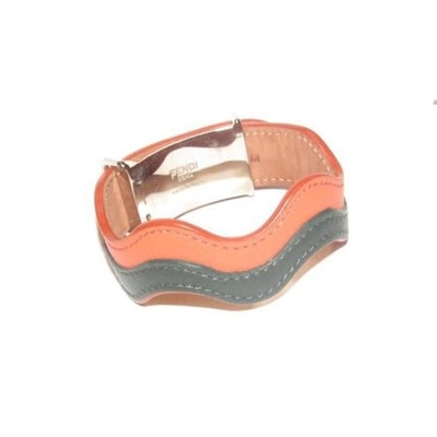 For sale is an AMAZING, Fendi, substantial, 'Strap You Wave' style, bangle bracelet in orange and: For sale is an AMAZING, Fendi, substantial, 'Strap You Wave' style, bangle bracelet in orange and black, hard leather and chrome with a 'Fendi' engraved, push button clasp that meets at the center! Th