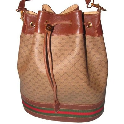 For sale is a Gucci, dark brown small G logo print on a lighter brown coated canvas and brown: For sale is a Gucci, dark brown small G logo print on a lighter brown coated canvas and brown leather, XL, drawstring top, bucket shaped satchel style shoulder bag with a red and green stripe at the b